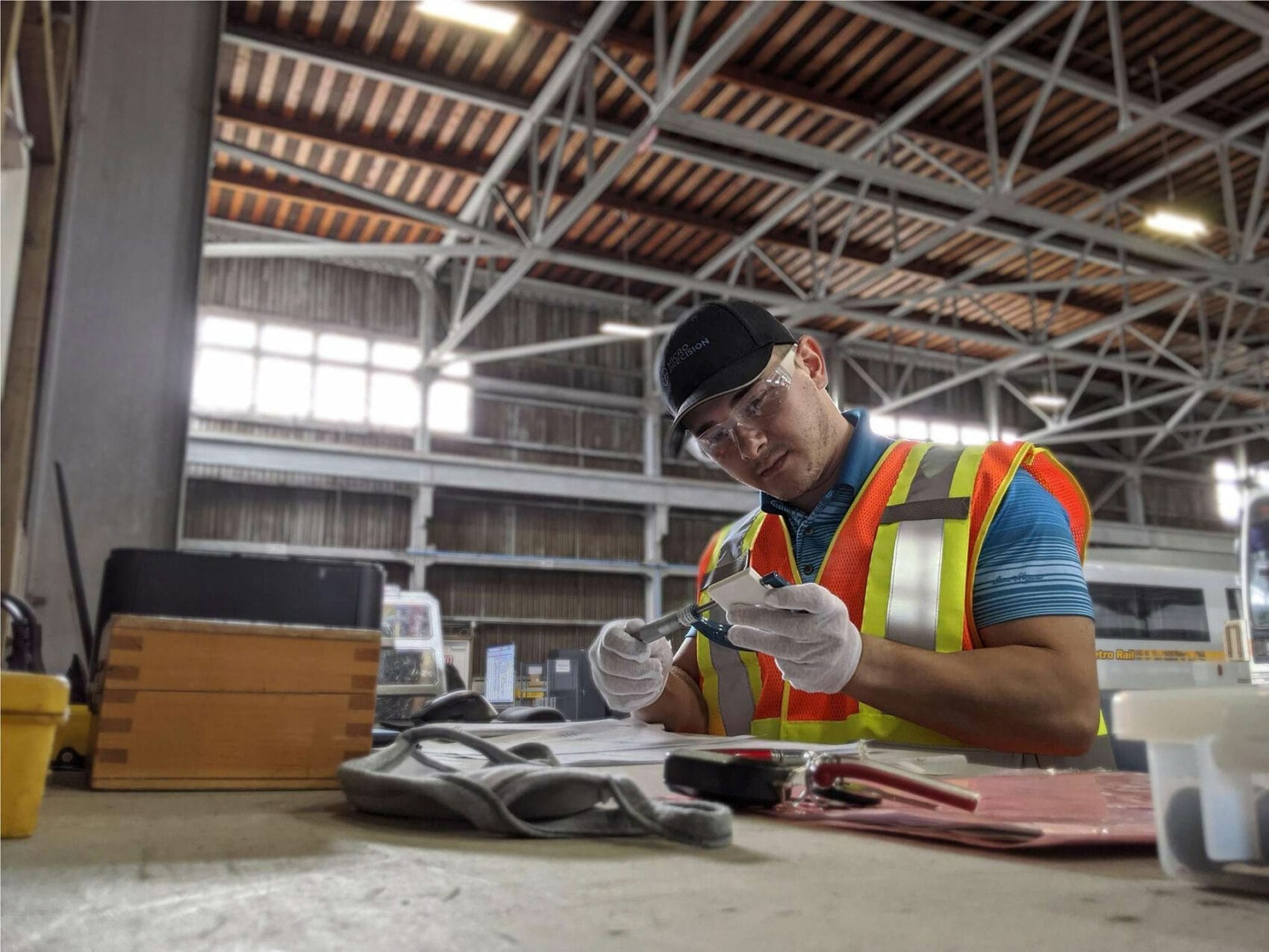 Technician measuring instruments with a caliper