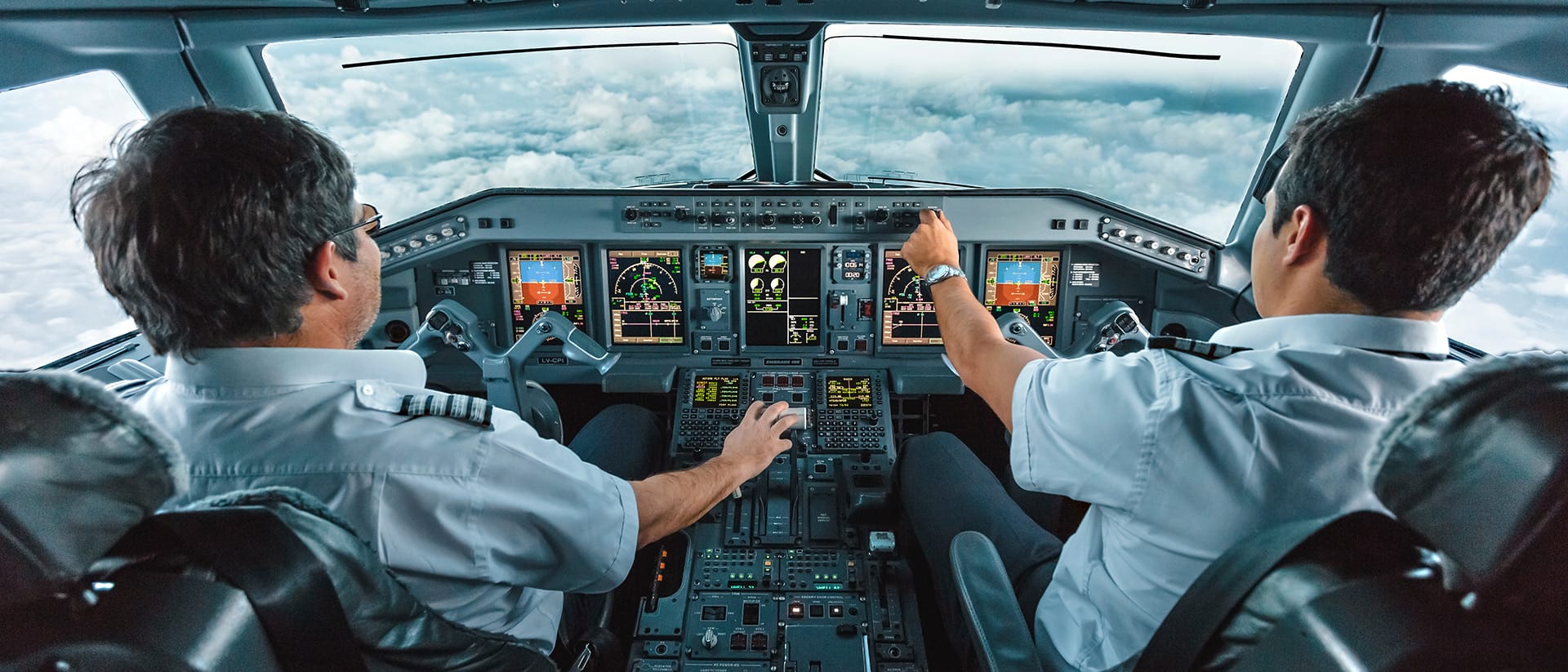 Pilots operating a commercial plane from the cockpit